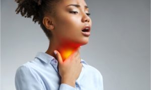 woman with throat pain